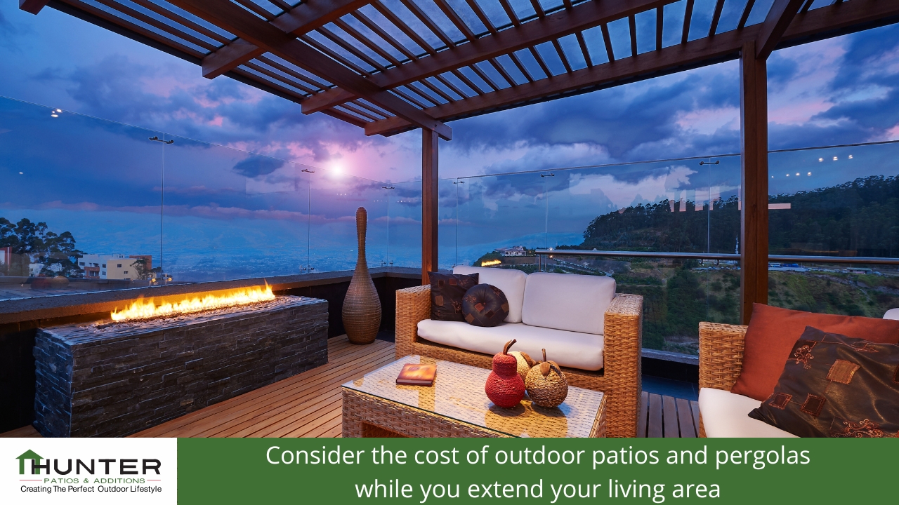 Modern patio with outdoor seating and fireplace.