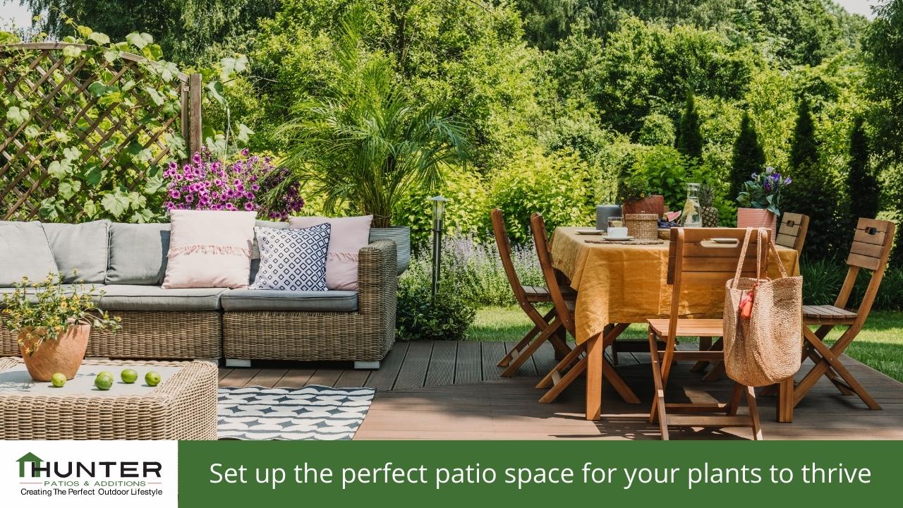 Outdoor patio with furniture and greenery