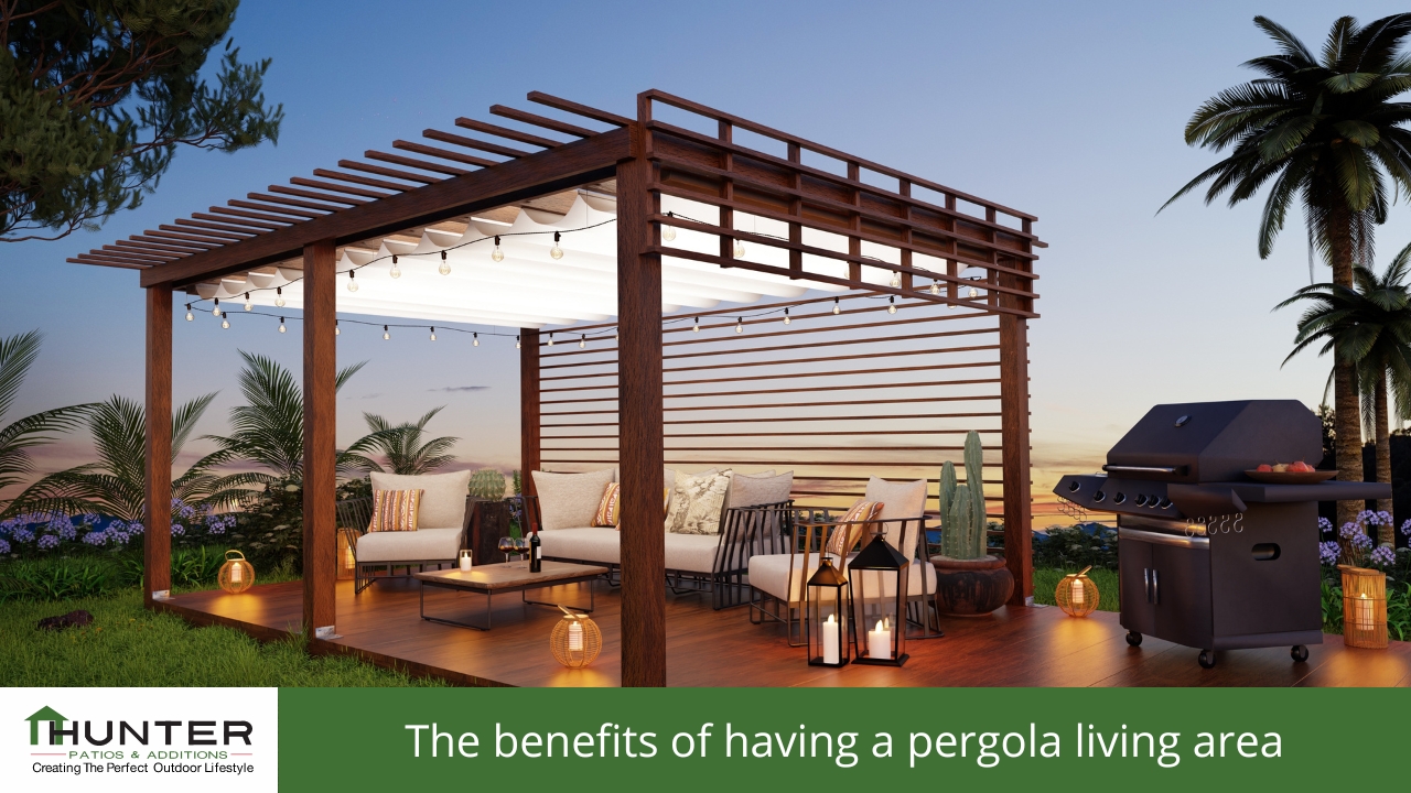 Modern pergola setup with seating and grill outdoors.