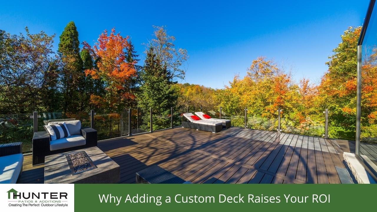 Spacious outdoor deck with colorful autumn trees.