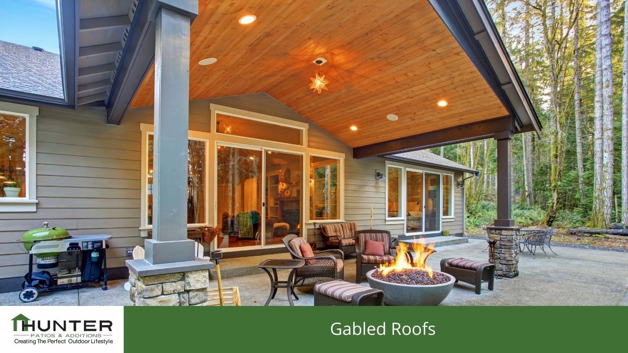 Modern patio with gabled roof and fire pit