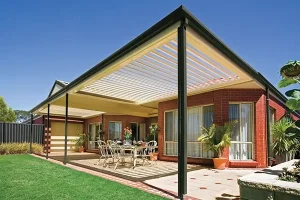 Modern patio with pergola and outdoor dining area.