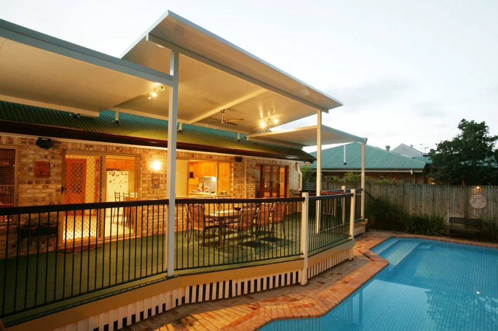 Modern patio with pool at dusk