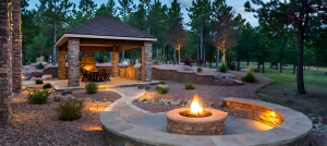 Cozy outdoor patio with a round firepit.